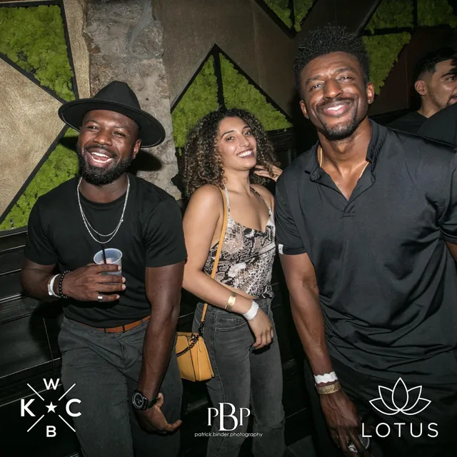 Guests posing at a Lotus event